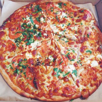 Cheese Board Pizza - Roma tomatoes, onions, mozzarella and Bulgarian feta cheese, lemon zest, lemon juice, garlic olive oil and cilantro. - Pizza Near Me - Berkeley, California