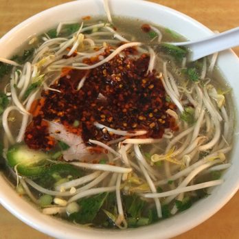 Phở Dollar - Pho tai (beef soup with rice noodles and rare beef slices) with bean sprouts and herbs added.  I added the chili. I like it SPICY! - Vietnamese Near Me - Buffalo, New York