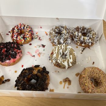 The Donut Experiment - Sorry half are gone, we were too hungry. Top right are like Mounds candy with chocolate dip, coconut topping, and caramel drizzle... - Donuts Near Me - Fort Wayne, Indiana The Donut Experiment - Sorry half are gone, we were too hungry. Top right are like Mounds candy with chocolate dip, coconut topping, and caramel drizzle... - Donuts Near Me - Fort Wayne, Indiana