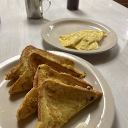 a plate of pancakes and eggs a plate of pancakes and eggs