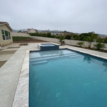 BP Water Concepts - Pool and spa with travertine stone and dark grey plaster - Pool & Hot Tub Service Near Me - Fallbrook, California BP Water Concepts - Pool and spa with travertine stone and dark grey plaster - Pool & Hot Tub Service Near Me - Fallbrook, California