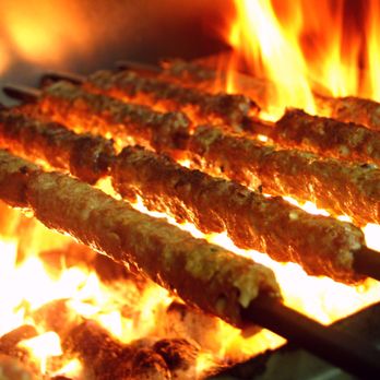 The Tandoor - a bunch of skewers being cooked on a grill - Indian Near Me - Edmonton, Alberta