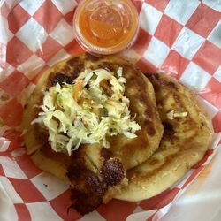 Restaurante Guatemalteco Dos Hermanos - Chicharrón pupusas served with tomato salsa and encurtido