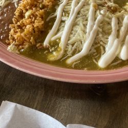 Cielito Lindo - From the weekly lunch menu, 3 chicken Enchiladas Suizas served with delicious rice and bean.