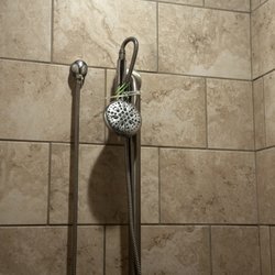 Anytime Fitness - They upgraded how the shower head is been held with now. A high end rubber band was the move!