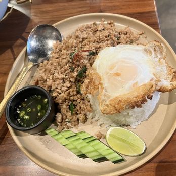 Hanuman Thai Eatery - Khao-Soi: Added some sauce from the Khao Ga Pow and it was perfect combination. - Thai Near Me - Costa Mesa, California