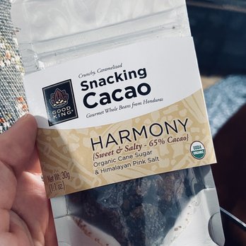 Chocolate Sommelier - a hand holding a bag of chocolate - Chocolatiers & Shops Near Me - Milwaukee, Wisconsin