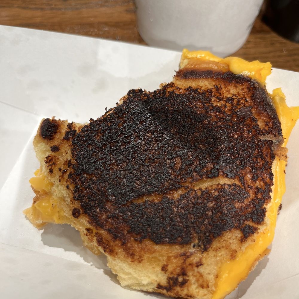 Shake Shack Franklin - Burnt grill cheese sandwich (one bite taken out of it), and you can see how small it is. - Burgers Near Me - Franklin, Tennessee