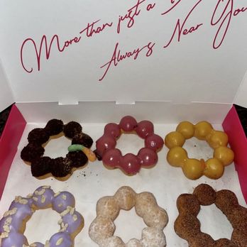 Mochinut - Half dozen mochi donuts: (l to r) Mud Pie, Black Currant, Mango, Taro Crunch, Sugar Snow, & Dirty Churro - Bubble Tea Near Me - Bellingham, Washington