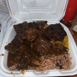 Oxtail, Jerk Chicken over rice with some lentils.