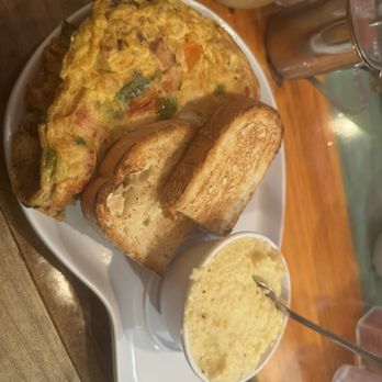 Two Chicks Café - CBD - Build your own omelette. Smoked turkey, goat cheese, veggies, grits with Gouda, sourdough toast. - Breakfast & Brunch Near Me - New Orleans, Louisiana Two Chicks Café - CBD - Build your own omelette. Smoked turkey, goat cheese, veggies, grits with Gouda, sourdough toast. - Breakfast & Brunch Near Me - New Orleans, Louisiana