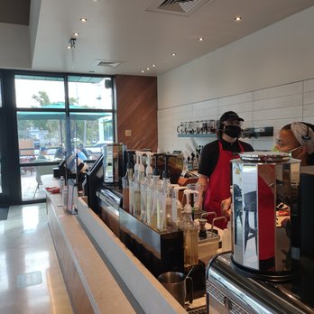 Starbucks - a bari serving customers in a coffee shop - Coffee & Tea Near Me - Wilton Manors, Florida Starbucks - a bari serving customers in a coffee shop - Coffee & Tea Near Me - Wilton Manors, Florida