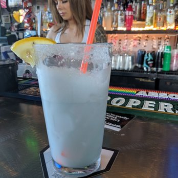 Lion's Lair - a woman at a bar with a drink - Bars Near Me - Spokane, Washington Lion's Lair - a woman at a bar with a drink - Bars Near Me - Spokane, Washington