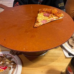a slice of pizza on a plate