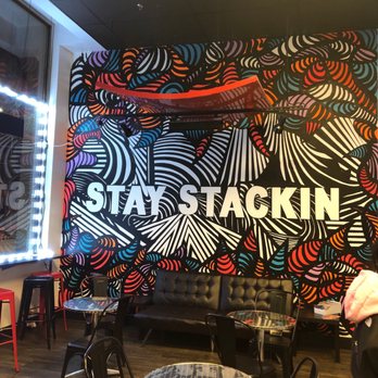 Sweet-Stack Creamery - Seating area and Stay Stackin mural - Desserts Near Me - Atlanta, Georgia Sweet-Stack Creamery - Seating area and Stay Stackin mural - Desserts Near Me - Atlanta, Georgia