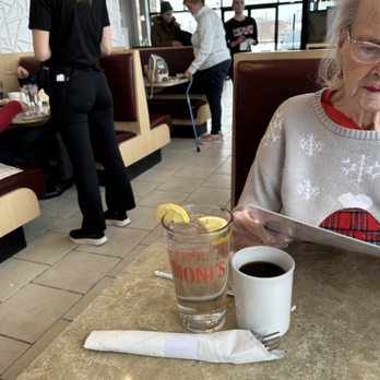 Moni's Restaurant - mom studying the menu - Breakfast & Brunch Near Me - Macomb, Michigan