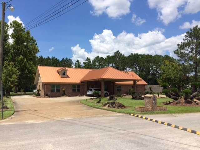 Slide of Greg's Roofing Of Bay County