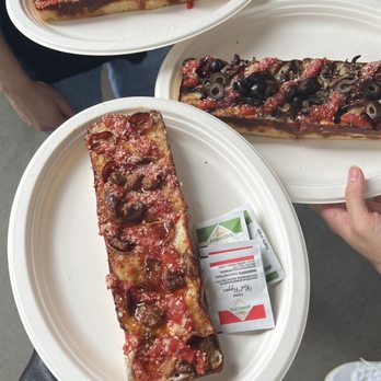MOTO Pizza - T-Mobile Park - Pizza in front and behind is the KISSD, while the pizza on the right is ROOT - Pizza Near Me - Seattle, Washington