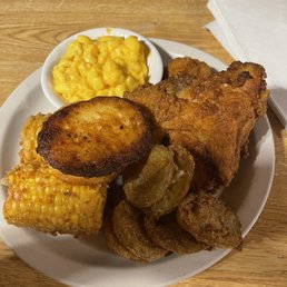 a plate of fried chicken, corn and macaroni a plate of fried chicken, corn and macaroni