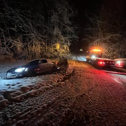 Snatched Towing & Recovery - The snow/ice got this one, but SNATCHED TOWING & RECOVERY was able to show up and get em out.