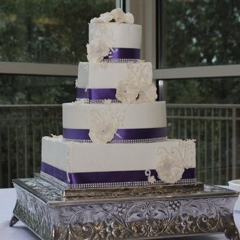 The Blue Pastry Box - a wedding cake on a table - Desserts Near Me
