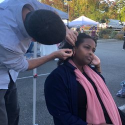 Community Acupuncture Project of Burien - Joey offering needles at the Sea Tac Farmers Market outreach day!