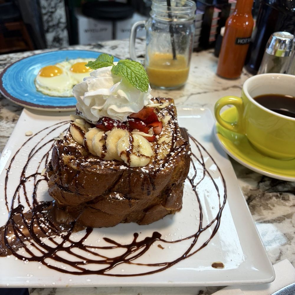 AmeriBrunch Cafe - I will remember this as yes honey . Nutella stuffed French toast with 2 sunny side up and black coffee . - Breakfast & Brunch Near Me - Las Vegas, Nevada