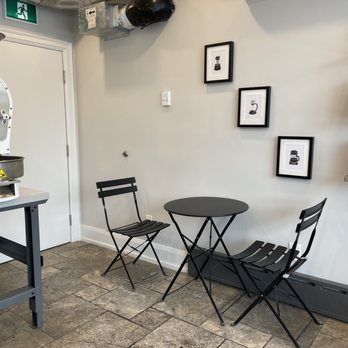 Terminal 3 Roasters - a table and two chairs - Coffee Roasteries Near Me - Toronto, Ontario Terminal 3 Roasters - a table and two chairs - Coffee Roasteries Near Me - Toronto, Ontario
