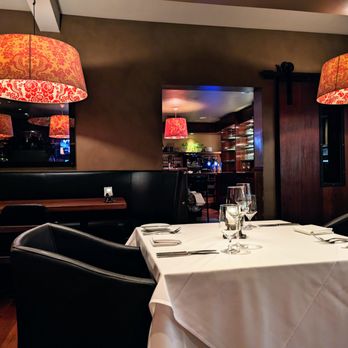 Bin 54 Steak & Cellar - Inside. Dining room. Wide U-shaped booth seating along the perimeter of the main dining room. White tablecloth smaller tables in the center. - Steakhouses Near Me - Chapel Hill, North Carolina Bin 54 Steak & Cellar - Inside. Dining room. Wide U-shaped booth seating along the perimeter of the main dining room. White tablecloth smaller tables in the center. - Steakhouses Near Me - Chapel Hill, North Carolina