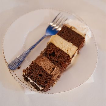 Michelle's - a slice of chocolate cake on a plate - Bakeries Near Me - Redlands, California