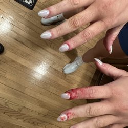 Nails Uptown - This butcher shop's handy work. My daughter went here to get her nails done before a wedding, and bled all the way home.