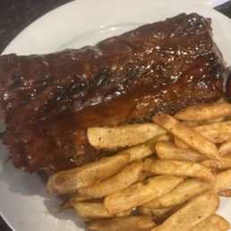 1/2 of bbq ribs with a side of French Fries.