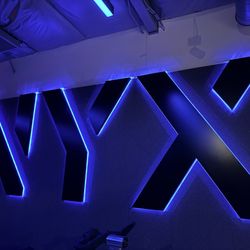 NYX Cycle + Fitness - Cool backdrop that lights up in class
