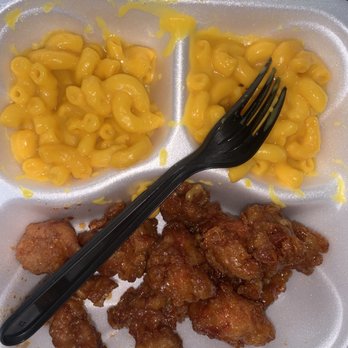 Cajun Grill - a plastic container with a fork and some macaroni and cheese - Cajun/Creole Near Me - Huntsville, Alabama