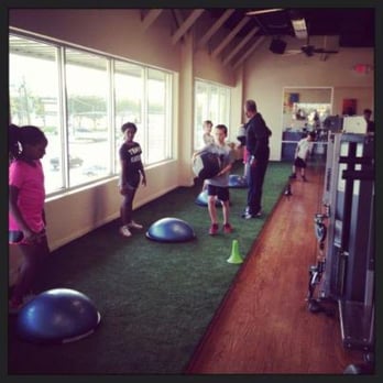 1st Class Training - Bellaire - Boys and girls engaged in speed and agility camp. It is held indoors on our turf. - Trainers Near Me - Bellaire, Texas