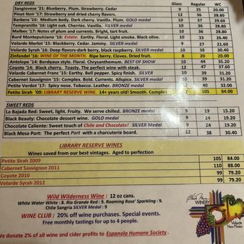 Black Mesa Winery - Menu - The menu displays a selection of red and sweet wines with descriptions, prices, and medals, including Petite Sirah, Cabernet Sauvignon, and Coyote. - Wineries Near Me - Velarde, New Mexico