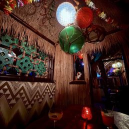 Private tiki hut in back bar Private tiki hut in back bar