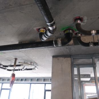 Solutions Plumbing - CAST pipe under a building .  solutions plumbing . - Plumbing Near Me