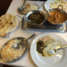 Clockwise from naan: coconut rice (too sweet), chicken palak, chicken tikka Balti, saffron rice.