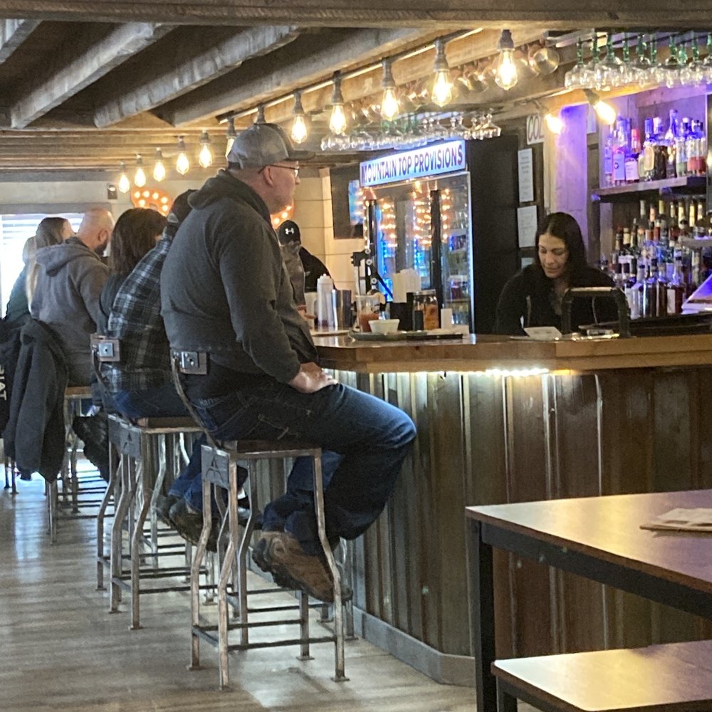 people sitting at the bar
