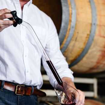 Crosby Roamann - a man pouring wine into a glass - Wineries Near Me - Napa, California Crosby Roamann - a man pouring wine into a glass - Wineries Near Me - Napa, California