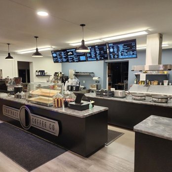 Contrast Coffee - a counter with a variety of items - Desserts Near Me - Negaunee, Michigan
