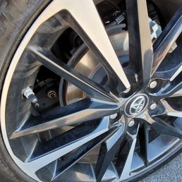 a close up of a tire on a car a close up of a tire on a car