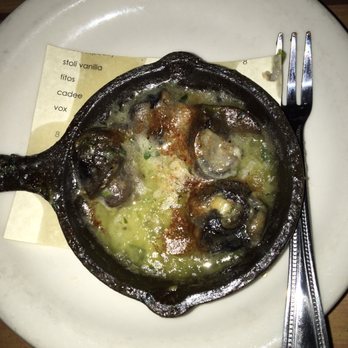Prima Bistro - Escargo appetizer in a tiny cast iron skillet - American Near Me - Langley, Washington