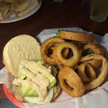 Iron Door Saloon - Grilled chicken chipotle avocado burger w/ onion rings. Yummy! - Bars Near Me - Groveland, California