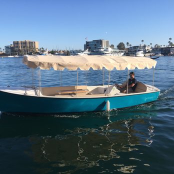 OC Boat Rentals - One of our 12 passenger Duffy electric boats pulling into the marina. - Boating Near Me - Newport Beach, California OC Boat Rentals - One of our 12 passenger Duffy electric boats pulling into the marina. - Boating Near Me - Newport Beach, California