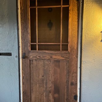 Fearn Woodworks - Custom door echoes detail in original front window. - Handyman Near Me