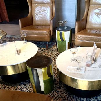 Hotel Vin - Dirty tables inside front door of hotel. Two unconcerned employees chatting nearby. - Hotels Near Me - Grapevine, Texas
