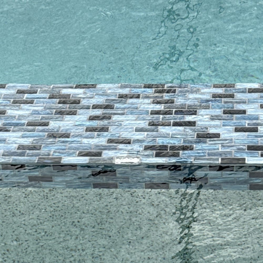 Sunscape Pools & Outdoor Design - Missing tile, dirty grout lines, concrete splashed on stucco - General Contractors Near Me - Bradenton, Florida Sunscape Pools & Outdoor Design - Missing tile, dirty grout lines, concrete splashed on stucco - General Contractors Near Me - Bradenton, Florida