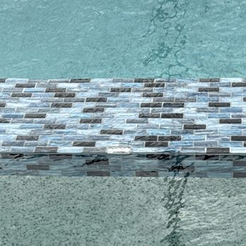 Sunscape Pools & Outdoor Design - Missing tile, dirty grout lines, concrete splashed on stucco - General Contractors Near Me - Bradenton, Florida Sunscape Pools & Outdoor Design - Missing tile, dirty grout lines, concrete splashed on stucco - General Contractors Near Me - Bradenton, Florida